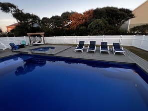 A swimming pool with four lounge chairs and a hot tub. - Topsail Beach Sunsets, Water views, Pool/Hot tub (N. Topsail Beach)