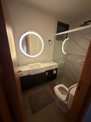 Shower, hair dryer, towels, soap