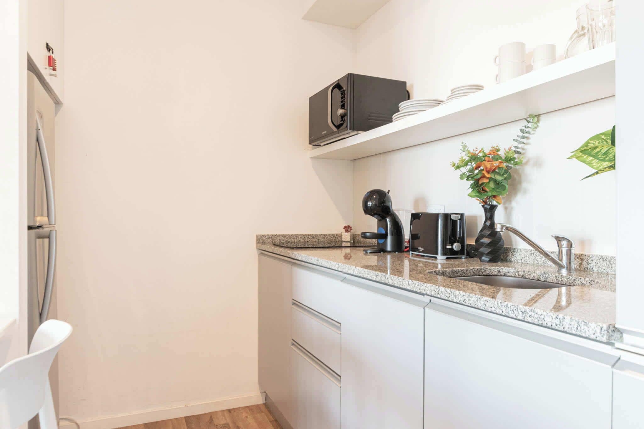 Microwave, coffee/tea maker, toaster, cookware/dishes/utensils