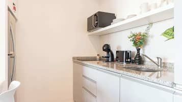 Microwave, coffee/tea maker, toaster, cookware/dishes/utensils