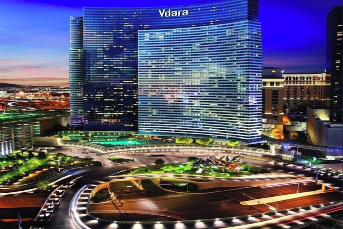 A modern high-rise building with the name 'Vdara' prominently displayed.