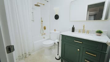 Shower, towels, soap, toilet paper