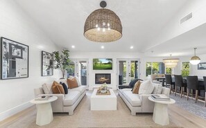 TV, fireplace - SWSS 4BR Tesoro Estate | Pool, Fire Table, Outdoor Living & 30‑Day Minimum (Scottsdale)