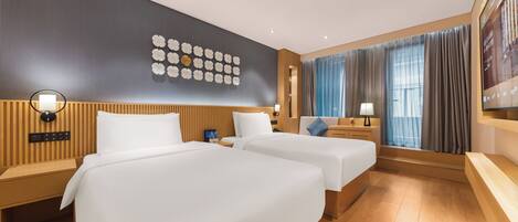 A hotel room with two beds, wooden headboards, a wall-mounted clock, a large window with curtains, and a flat-screen TV.