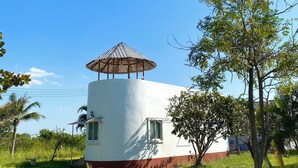 A single-story building with a conical roof structure, a small window, and a door. - The Peak Resort Chaiyaphum (Chaiyaphum)