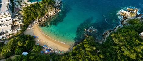 On the beach, sun-loungers, beach umbrellas