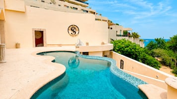2 outdoor pools, open 8:00 AM to 8:00 PM, pool umbrellas