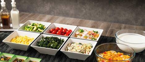 A table with various food items and condiments.