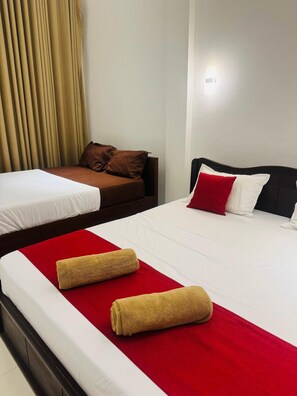 Family Triple Room, Garden Area | Hypo-allergenic bedding, individually furnished, desk, soundproofing - Asai surf inn Arugambay  (pottuvil)