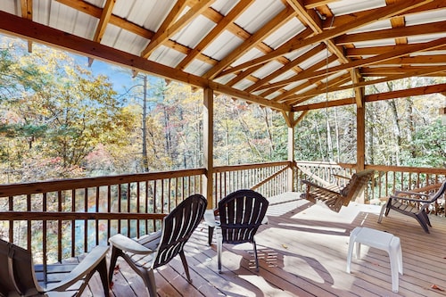 Dog-friendly home with serene views, outdoor hot tub, deck, and fire pit