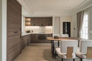 Premier Apartment, 1 Bedroom, Patio, City View | Private kitchen | Fridge, microwave, cookware/dishes/utensils, cleaning supplies - Thai Hoang Residence - 15 Thai Phien (Ha Noi)