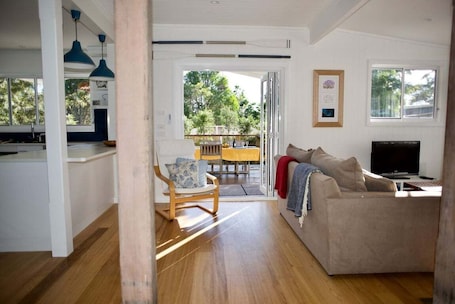 TV, fireplace. Alora Cottage ~ Beach House in Bendalong