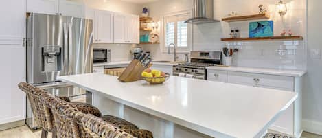 Fridge, stovetop, dishwasher, coffee/tea maker