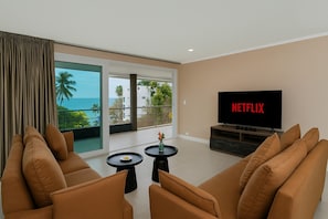 Family Apartment, 2 Bedrooms, Balcony, Sea View | Living area | 55-inch Smart TV with cable channels, Netflix, streaming services - Woodbridge Property at Karon Butterfly (Karon)