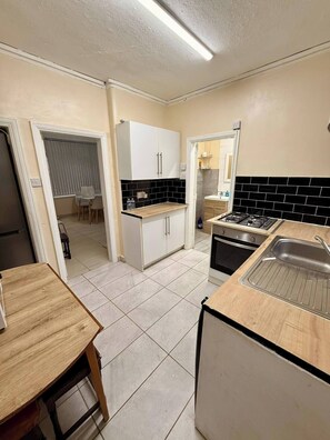 Fridge, microwave, cookware/dishes/utensils