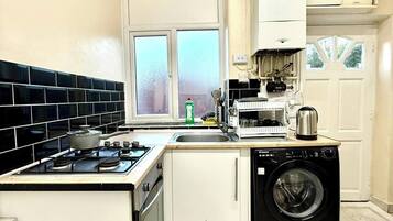 Fridge, microwave, cookware/dishes/utensils