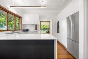 Fridge, microwave, oven, stovetop - Family-Friendly Home in Vibrant West End (West End)