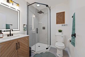 Shower, hair dryer, towels, shampoo
