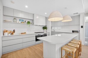 Fridge, microwave, oven, stovetop - Coastal Luxe 4-Bed House in Madora Bay (Madora Bay)