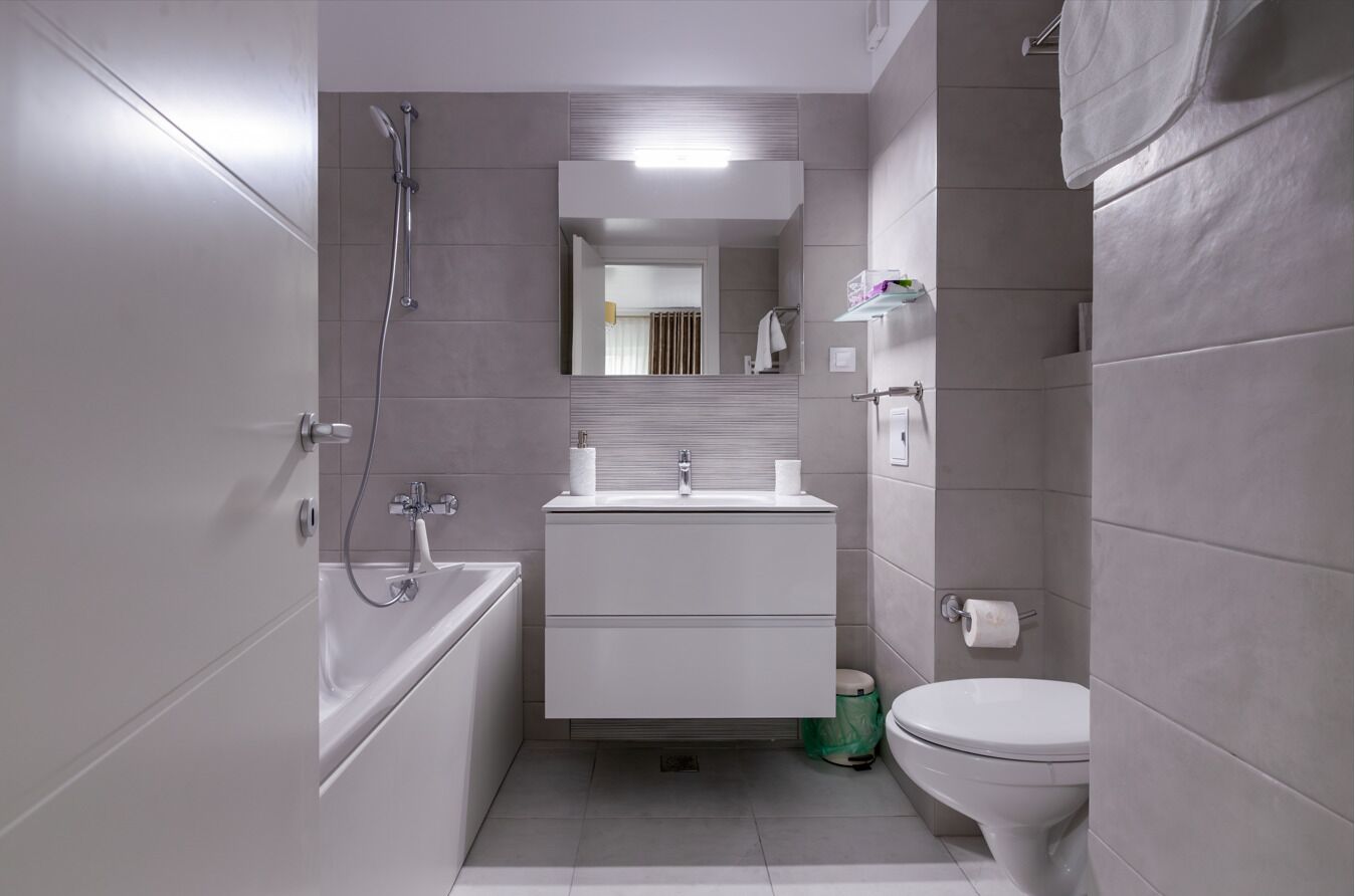 Apartment, Balcony, City View | Bathroom | Shower, bathrobes, slippers, towels