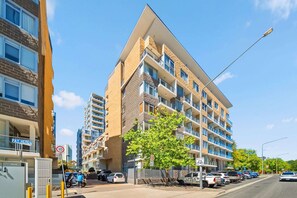 Exterior - Spacious Apartment with Gym & Pool Access (City)