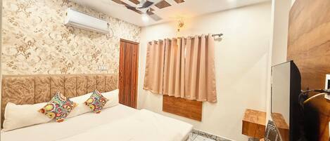 Premium bedding, desk, laptop workspace, free WiFi