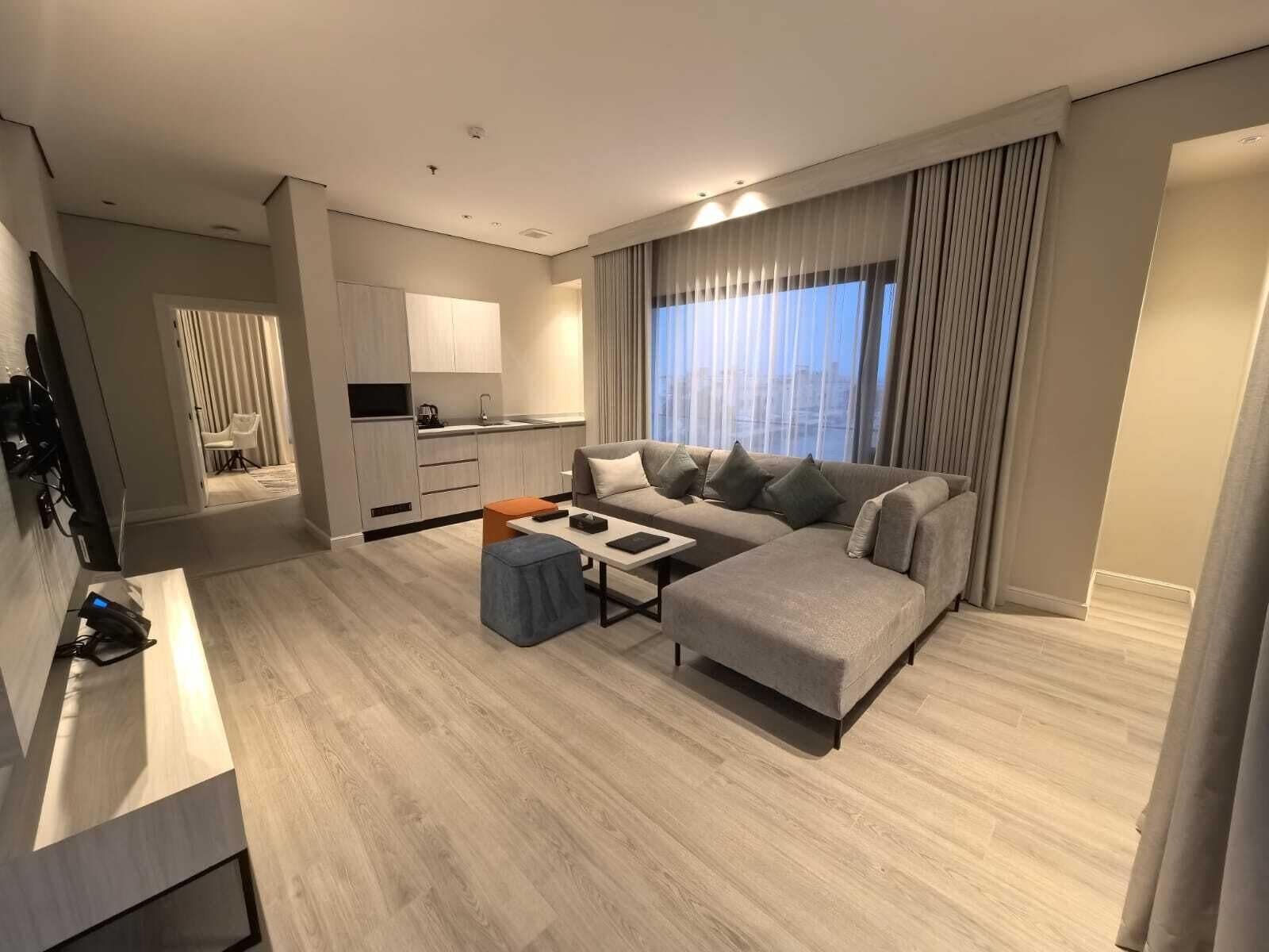 Deluxe Suite | Living area | 55-inch LCD TV with satellite channels, printers