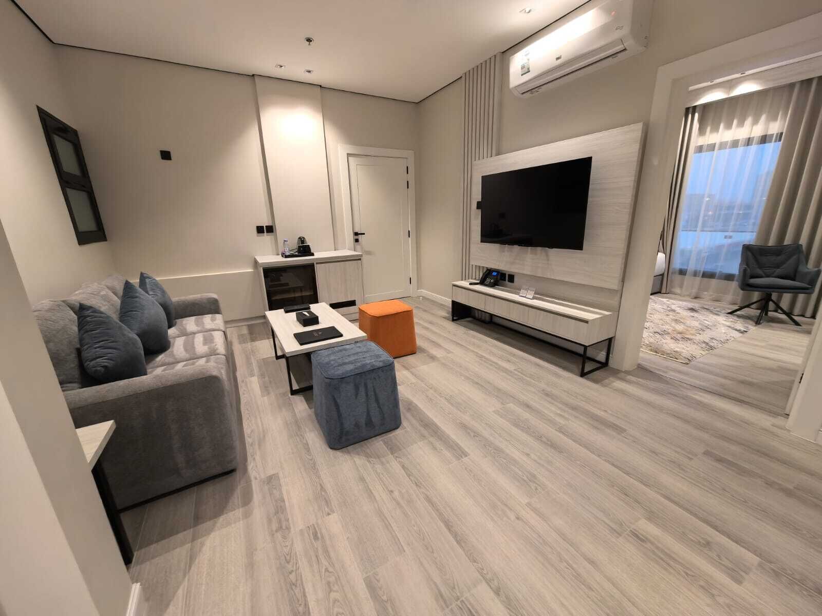 Junior Suite | Living area | 55-inch LCD TV with satellite channels, printers