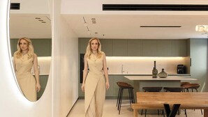 A modern kitchen with a central island, a dining area with wooden tables, and a large mirror on the wall. - Artemis  Luxury Apartment with Private Pool and Stunning Views in Tiberias (Tiberias)