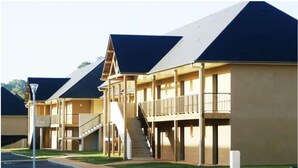 A row of modern, two-story buildings with flat roofs and balconies. - Modern studio with terrace 5 min from Honfleur parking and swimming pool (Équemauville)