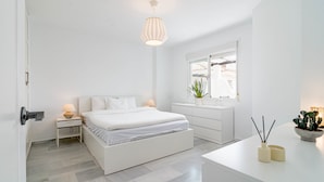 A modern bedroom with a bed, bedside tables, a window, and a nightstand. - Lnm530 - Great Location With Private Roof Terrace (Marbella)