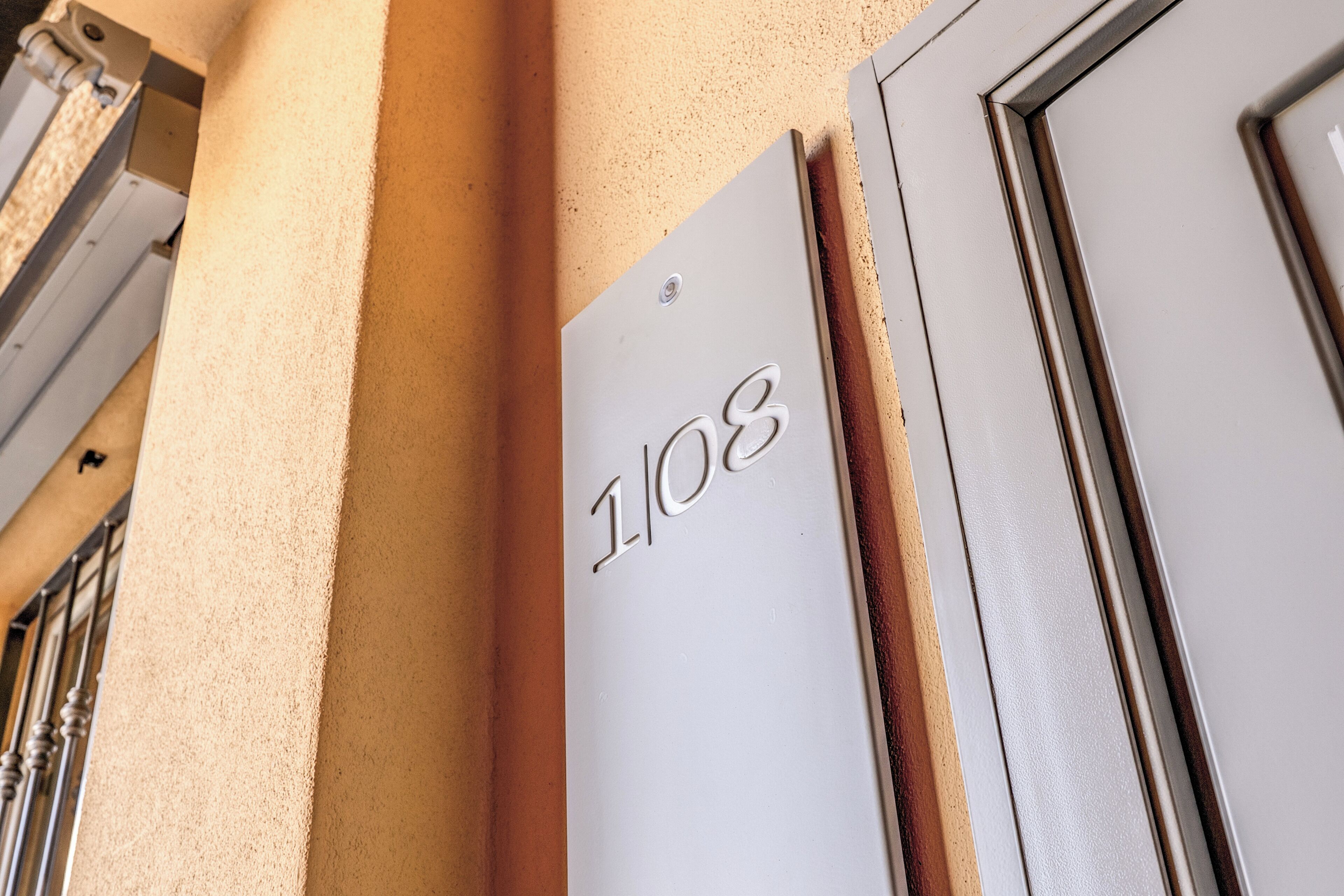 A door with the number 108 on it, indicating a room number.