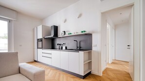 Apartment, 3 Bedrooms, Balcony | Private kitchen | Electric kettle, dining tables - Two Flats Combined - Near Loreto Metro (Milan)