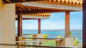 A balcony with a view of the ocean and a ship in the distance. - 2 Mins to Beach w/ Ocean & Pool Views by Bocobay (Noord)