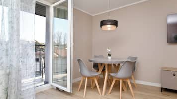 Family Apartment, Balcony | Living area | Flat-screen TV