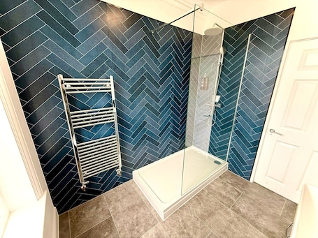 Shower, hair dryer, towels, soap. Luxury Modern Family Studio in Southwold | Pet Friendly