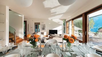 Apartment, Lake View | Living area | 30-inch TV with digital channels