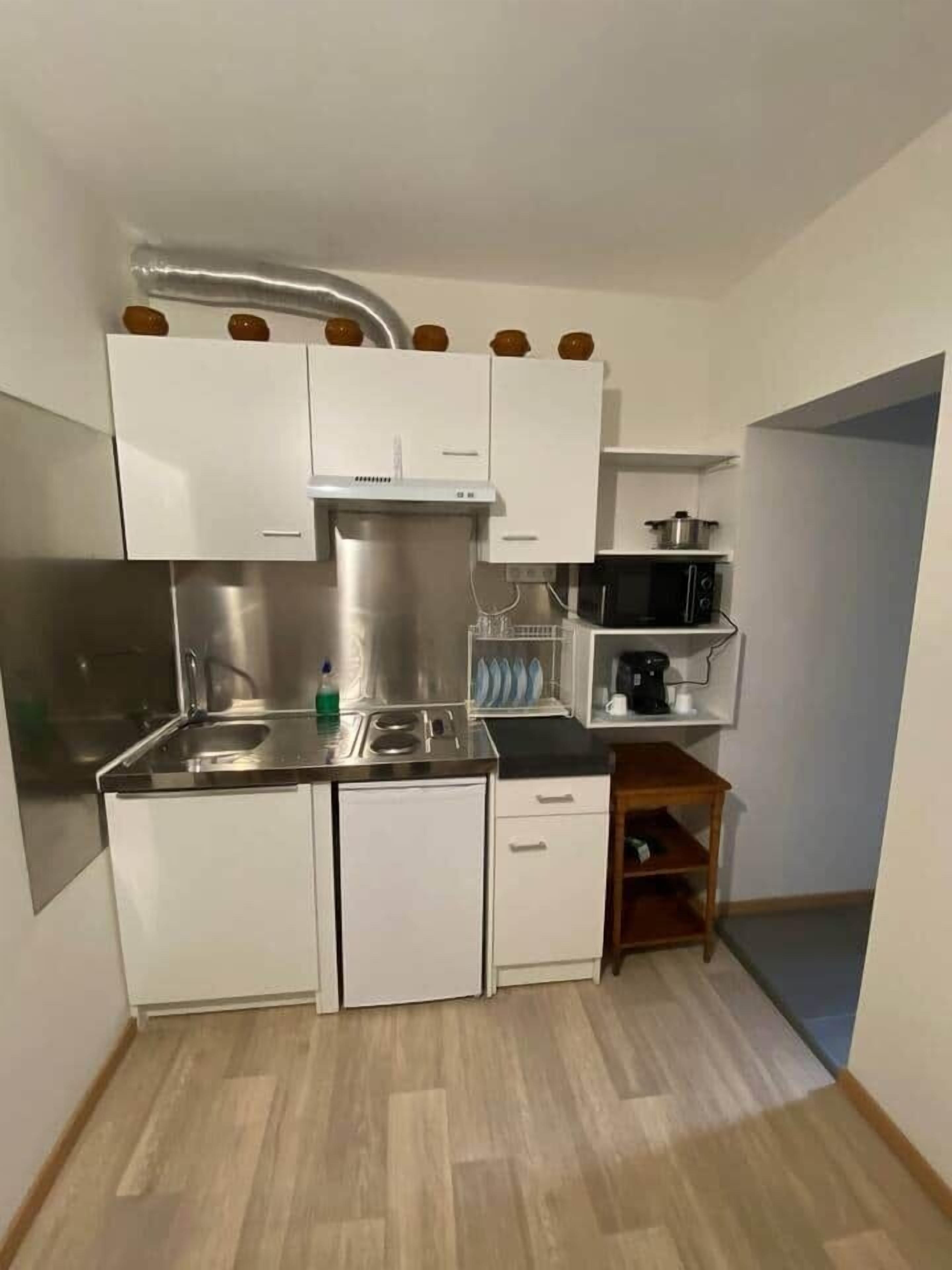 Fridge, microwave, cookware/dishes/utensils