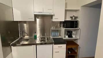 Fridge, microwave, cookware/dishes/utensils