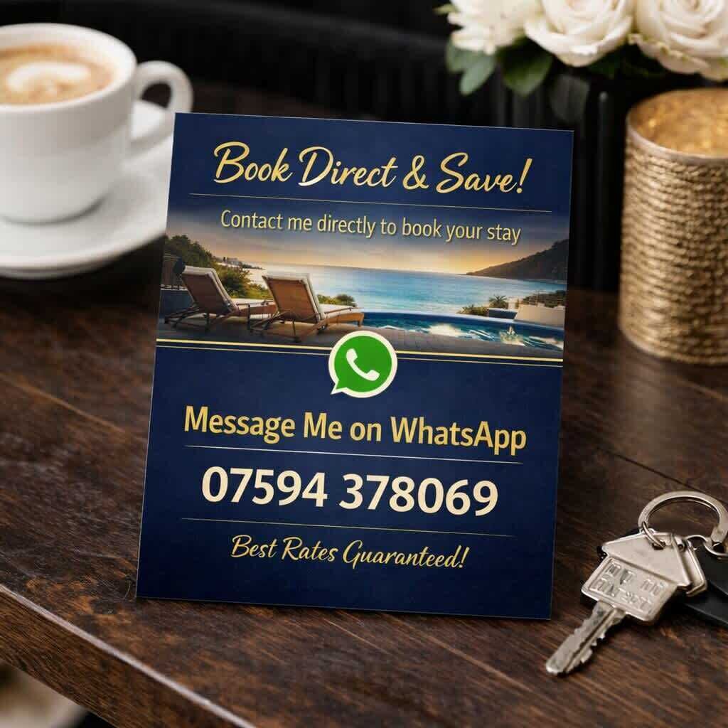 A promotional sign with a contact number and a WhatsApp prompt for booking a stay.