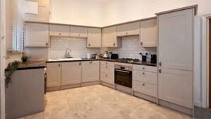 Coffee/tea maker, fridge, microwave, oven