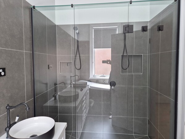 Shower, towels, soap, toilet paper