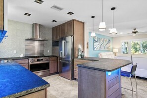Fridge, microwave, oven, stovetop - Sapphire Serenity · Glass Walls · Pool · 30-Night (Holmes Beach)