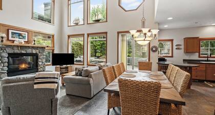 Cozy fireside retreat by Proposal Rock with ocean views, sun.