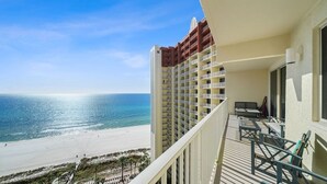 A balcony with a view of the beach and ocean. - Shores 1613-King Bed-Beachfront Resort & Amenities (Panama City Beach)