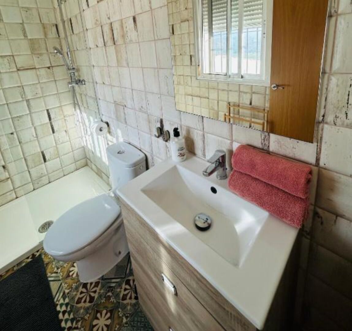 Shower, towels, soap, toilet paper