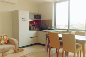 Premier Apartment | Private kitchen | Microwave, stovetop, highchair, cookware/dishes/utensils