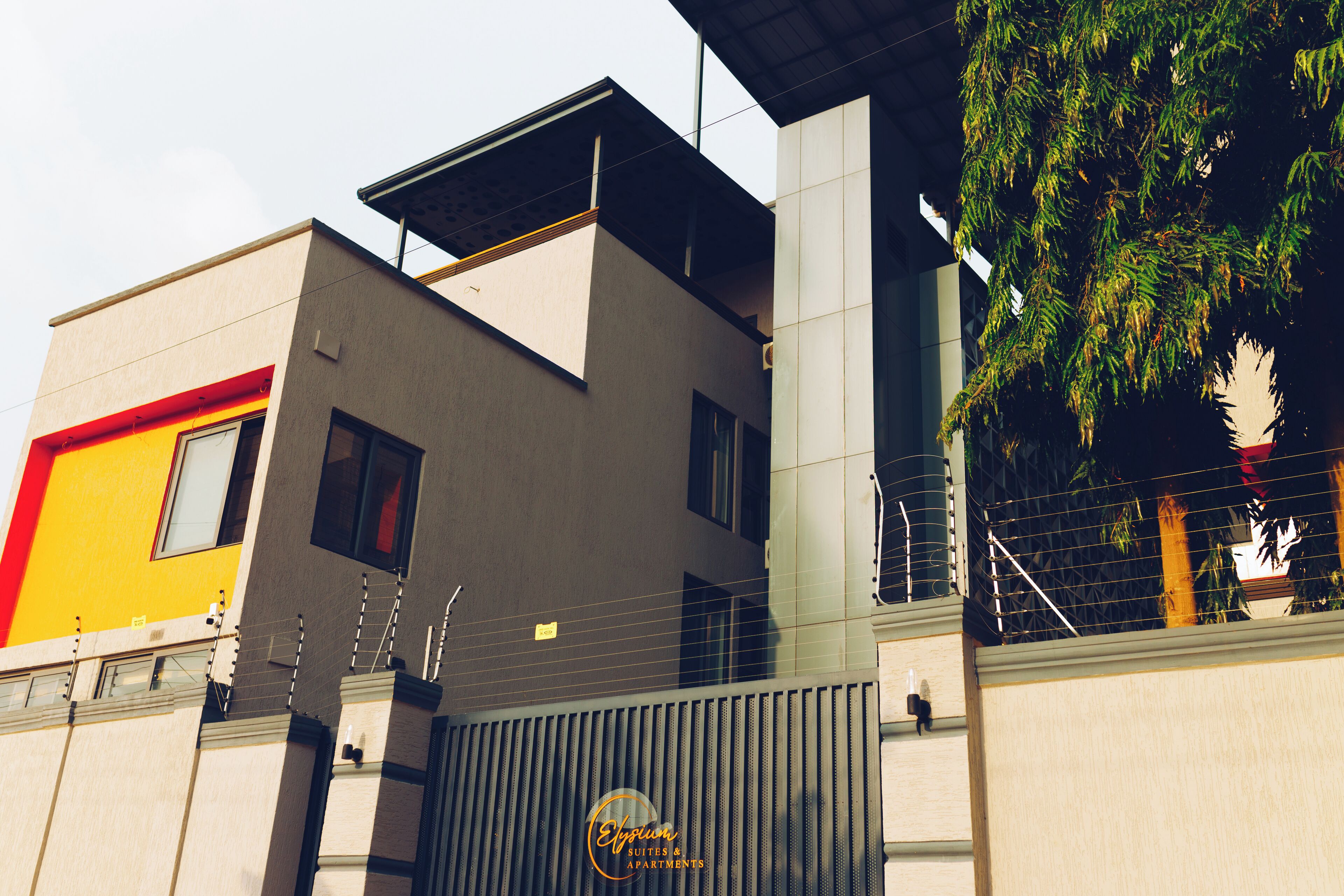 A modern building with a mix of architectural styles, including a flat roof and a sloped section.