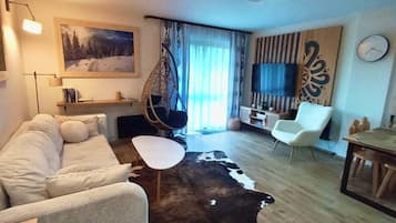 Deluxe appartement | Woonruimte | Flatscreentelevisie