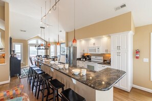 Fridge, microwave, oven, stovetop - Pet-friendly semi oceanfront home w/ pool and hot tub by Sun Realty (Nags Head)
